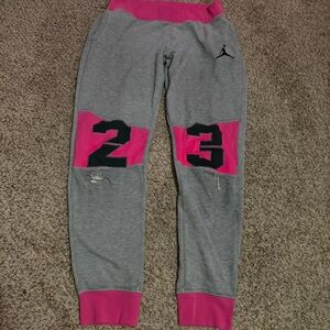 Grey and pink Y2K Jordan sweatpants with natural wear